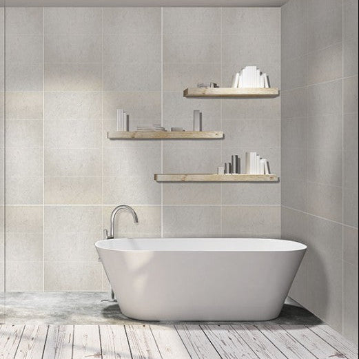 Modern bathroom with freestanding bathtub, shower, and shelves.