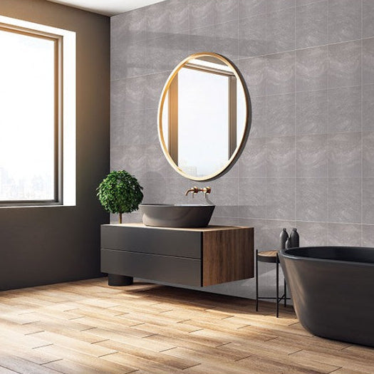 Modern bathroom with freestanding bathtub, sink, and mirror.