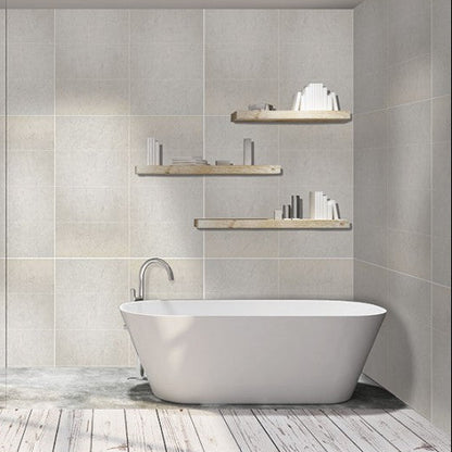 Modern bathroom with freestanding bathtub, shower, and shelves.