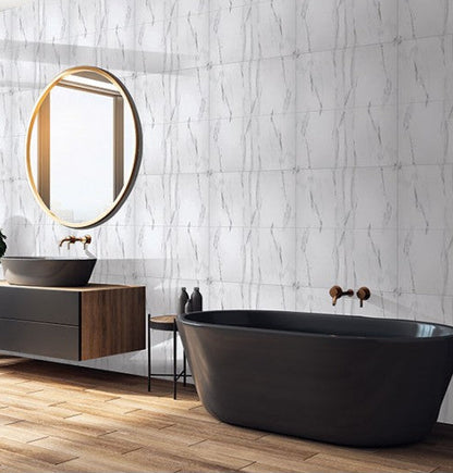 Modern bathroom with black freestanding bathtub, wooden vanity, and round mirror.