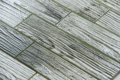 Close-up of gray and white tiles with a herringbone pattern